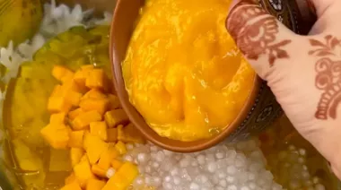 Glass bowl filled with mango sago 
